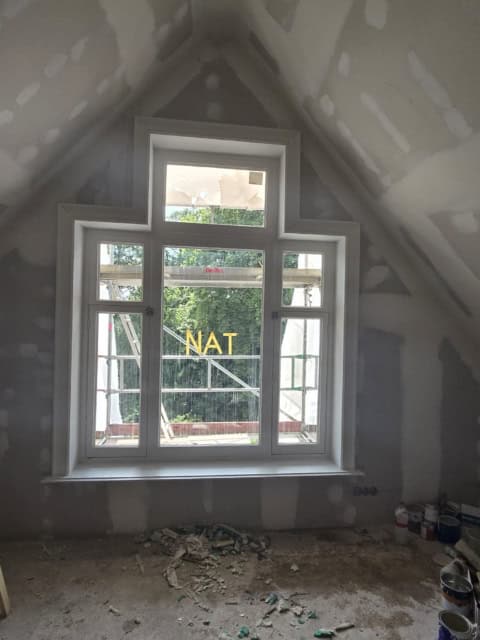 image showing a window with the work of Interior Trim and Casing Installation
